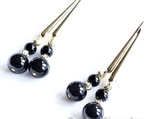 Oorbellen Vergulde oorstekers met onyx