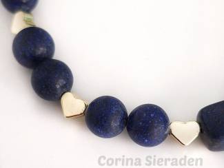 Armbanden Armband van lapis lazuli en vergulde accenten.